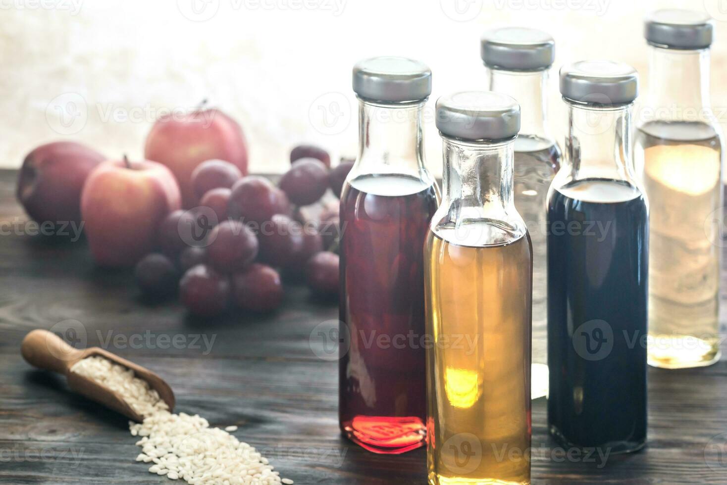 Bottles with different kinds of vinegar photo