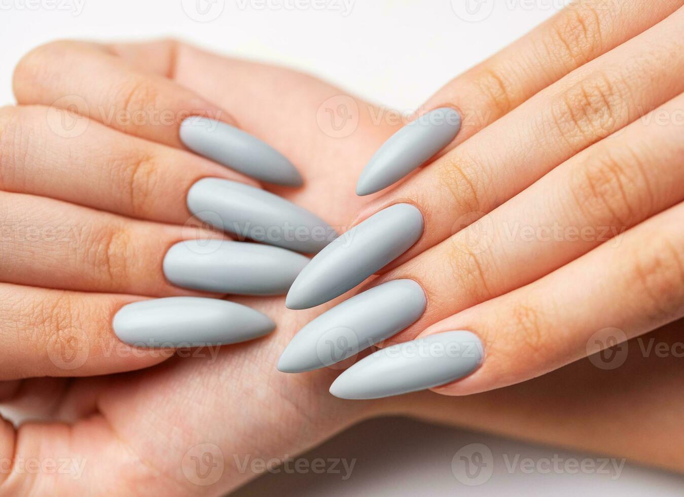 Woman's hand with grey nail polish photo