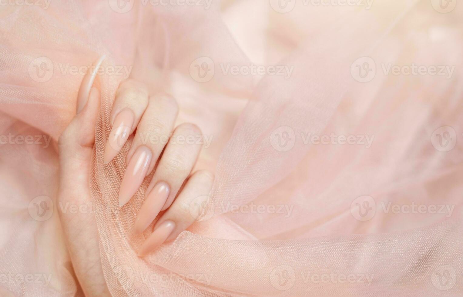 Elegant pastel pink natural manicure. photo