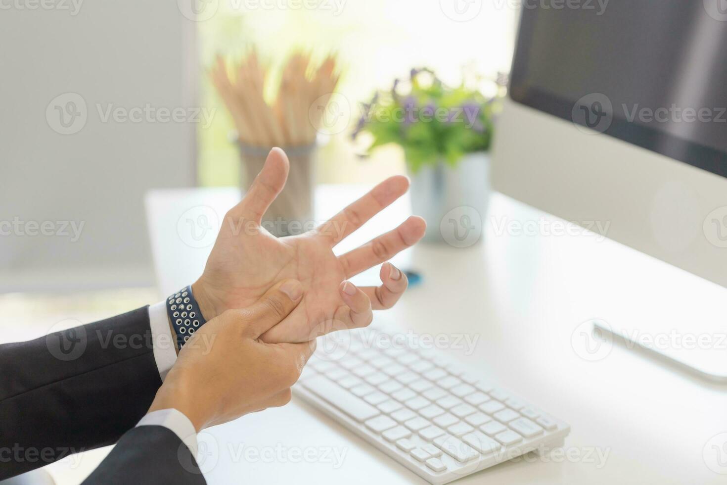 Man suffering pain in hands and fingers, Unhealthy office man hand injury photo