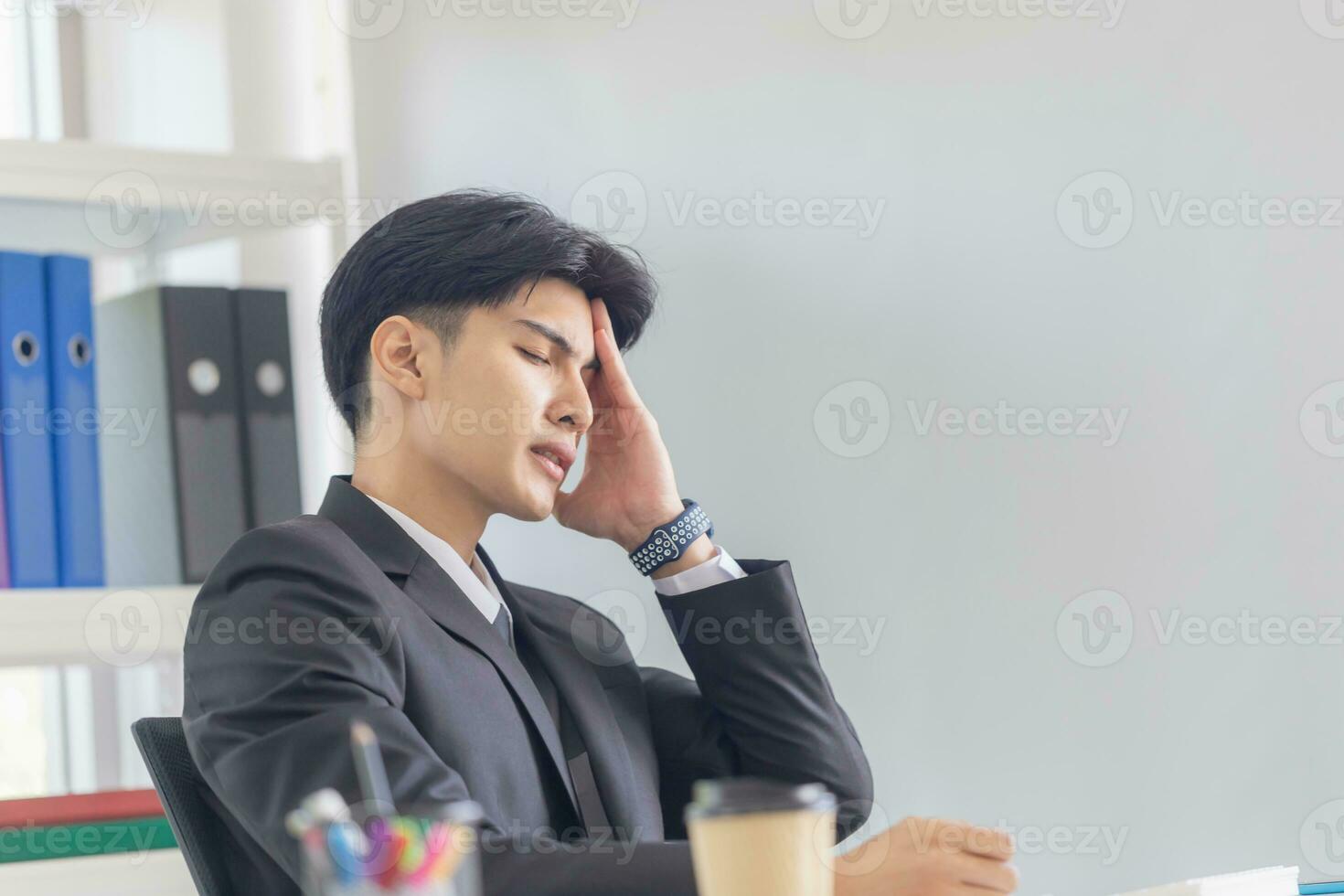 Unhealthy man touch forehead suffers from migraine strong headache, Businessman massaging temples close up, suffering from strong head ache photo