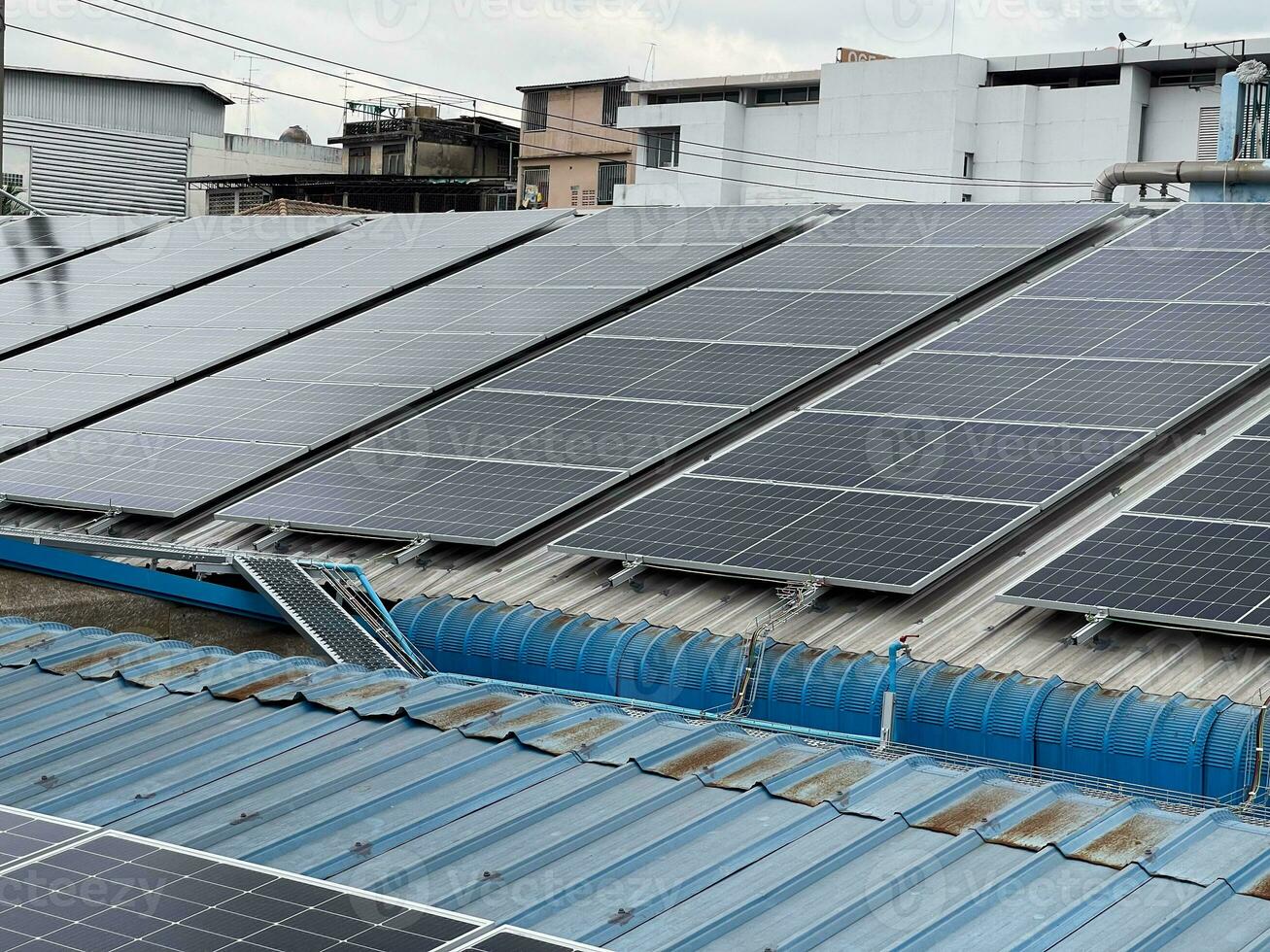 Solar panels on the warehouse roof. Renewable energy concept and green energy abstract. photo