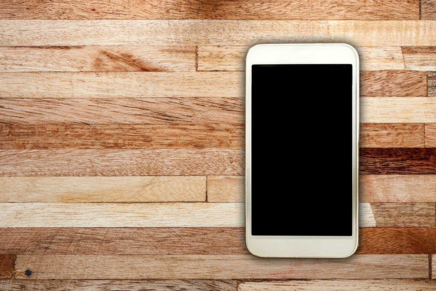 White smart on wooden desk photo