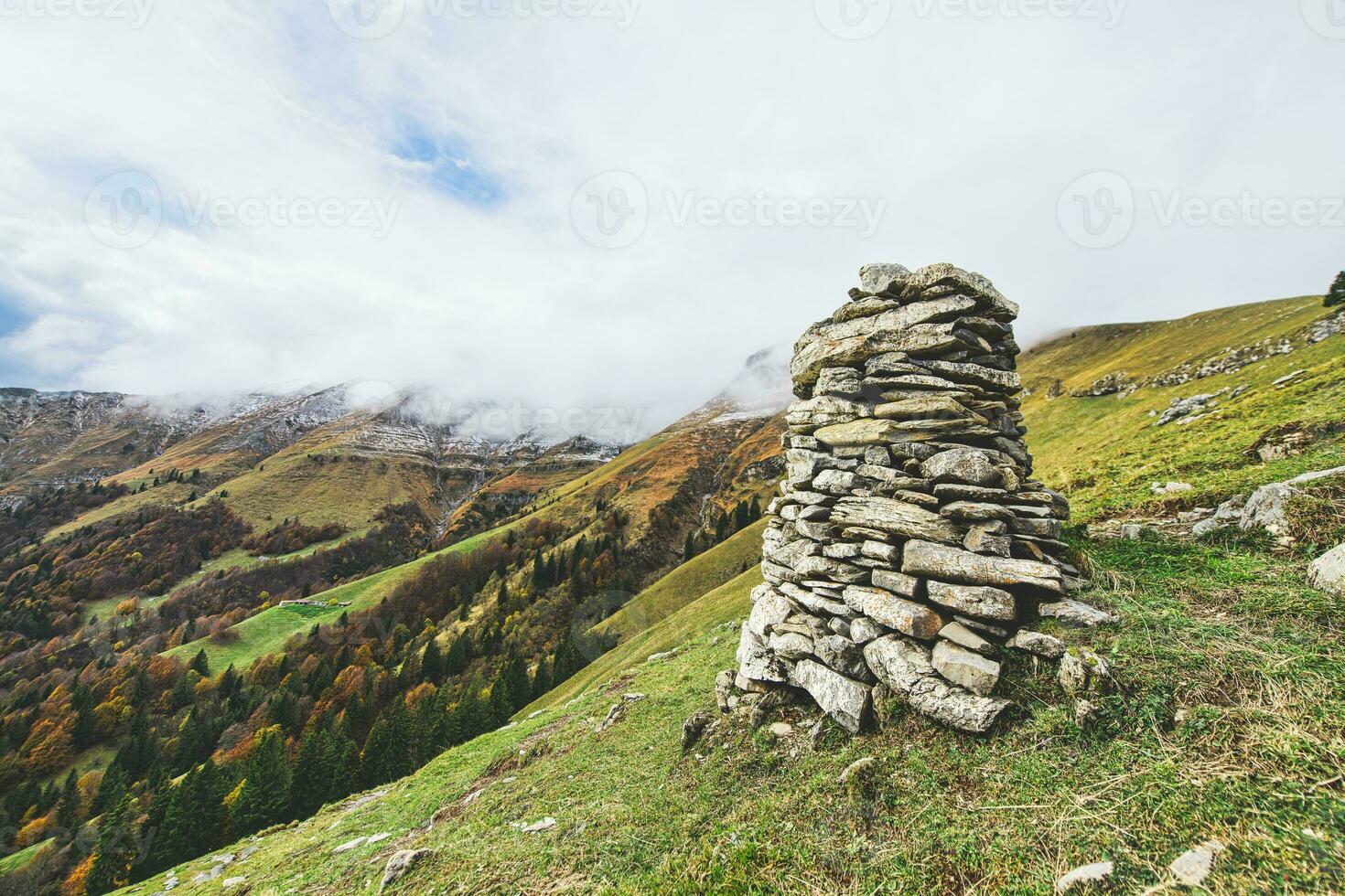 Marks way of boulders piled up in the mountains photo