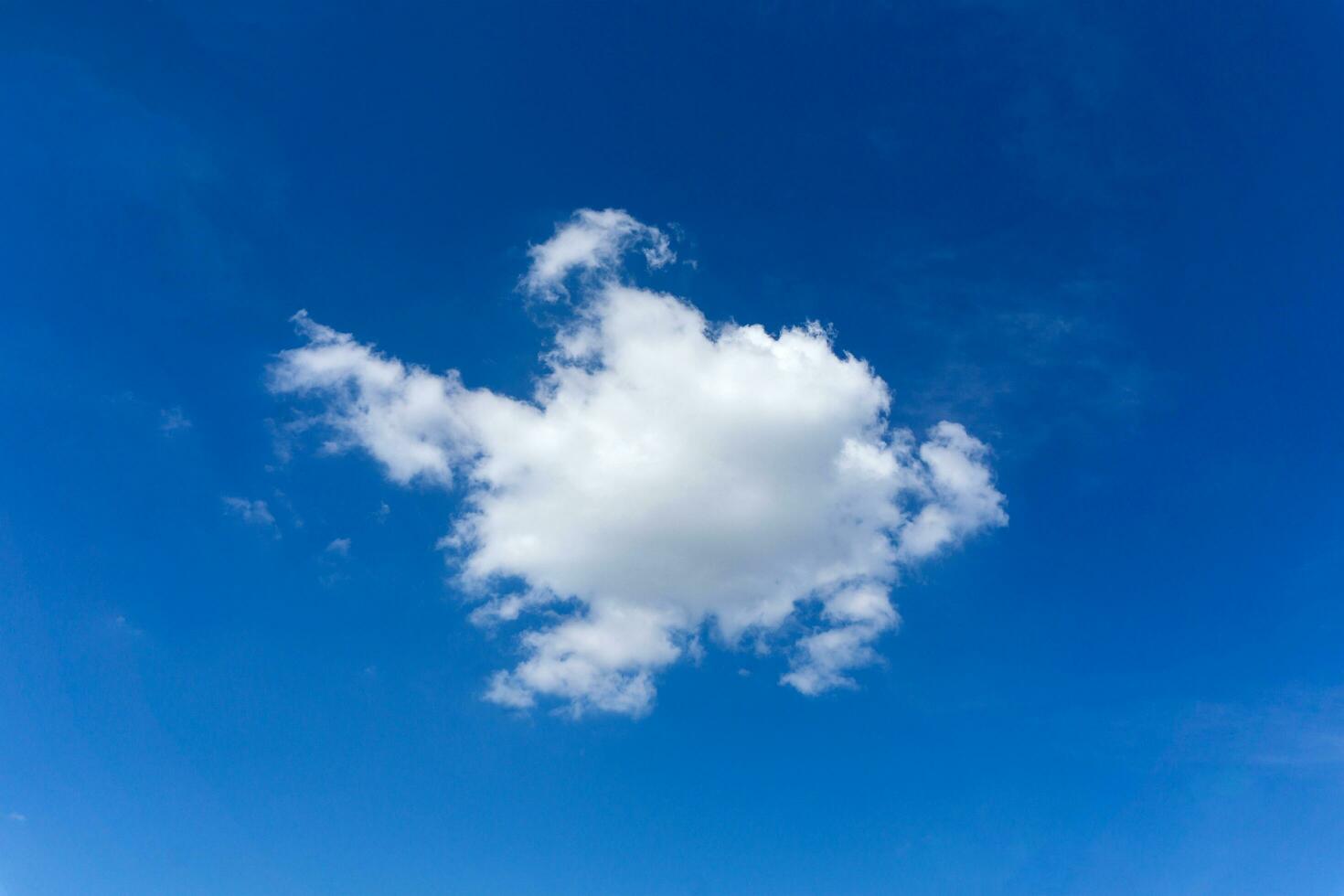 Sky and One cumulus cloud on blue sky. photo