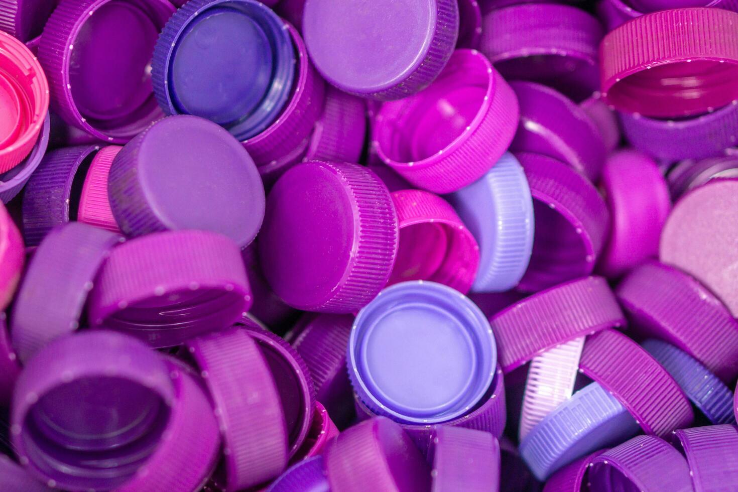 The plastic lid that is left over from the bottles are collected to be recycled into other items for reuse. photo