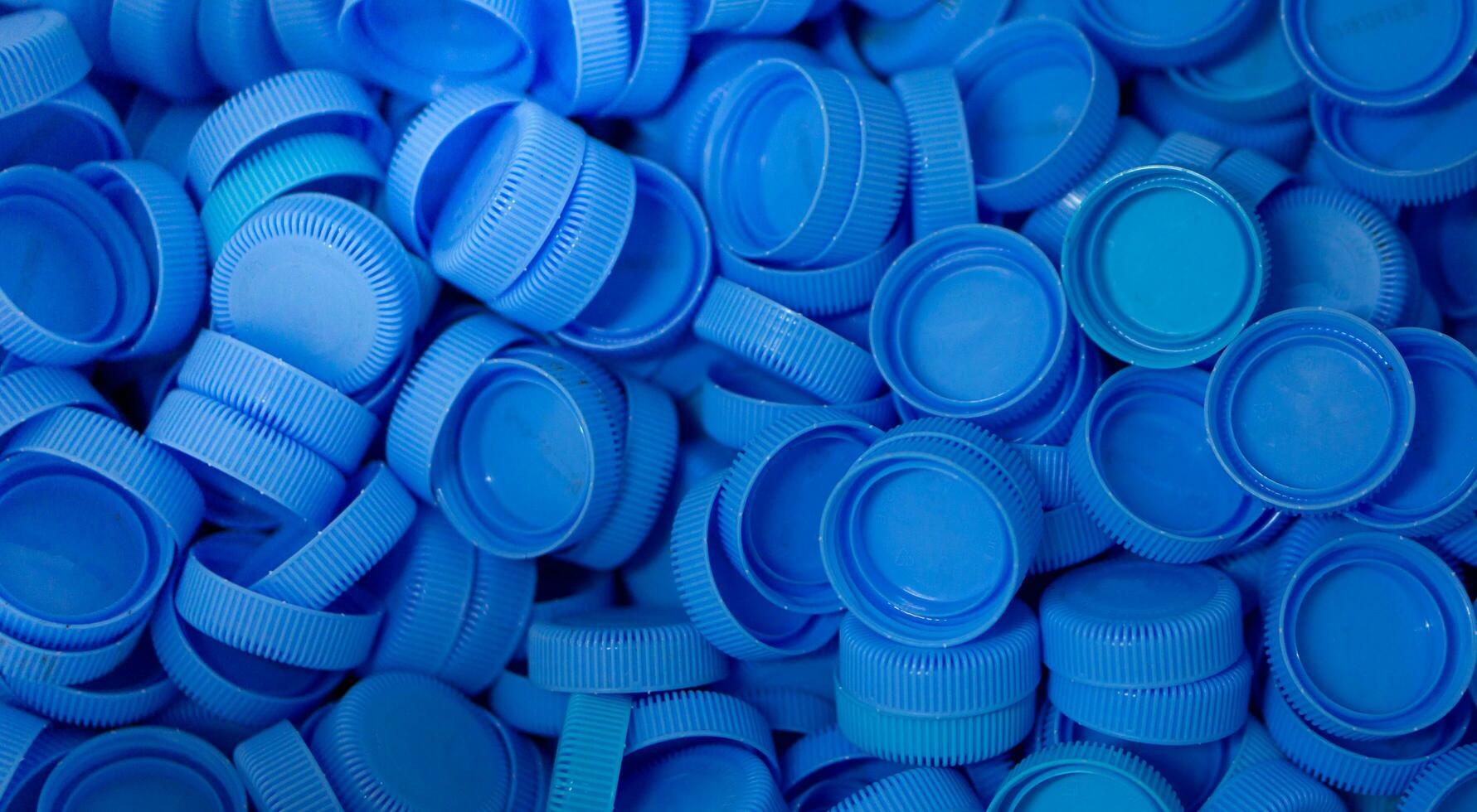 The plastic lid that is left over from the bottles are collected to be recycled into other items for reuse. photo