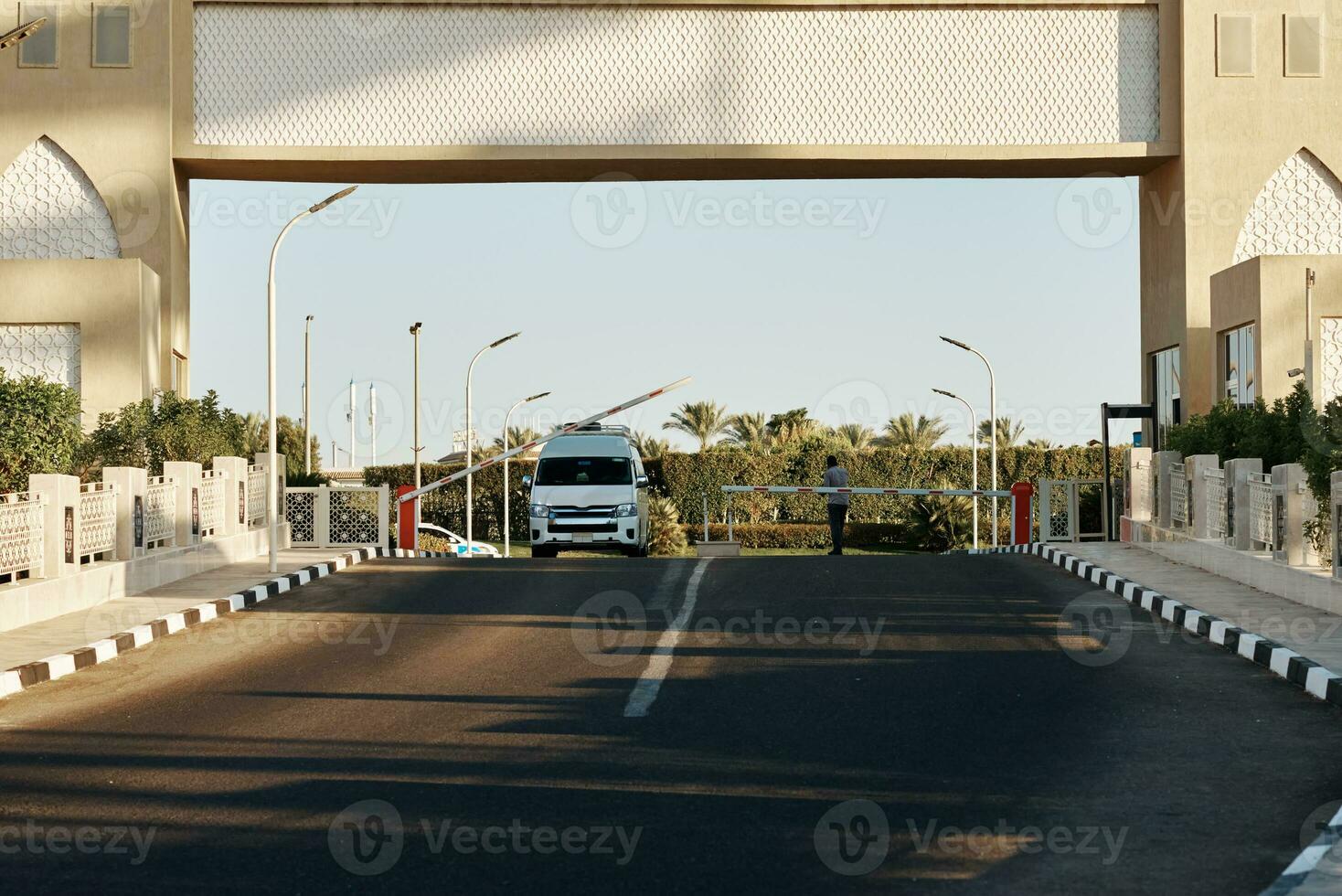 Guarded entrance to the territory with automatic barrier photo