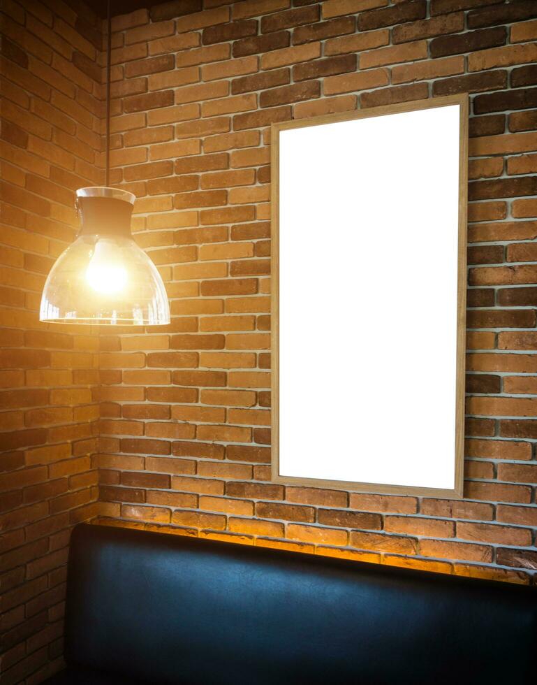 Blank photo frame mockup template on block wall.