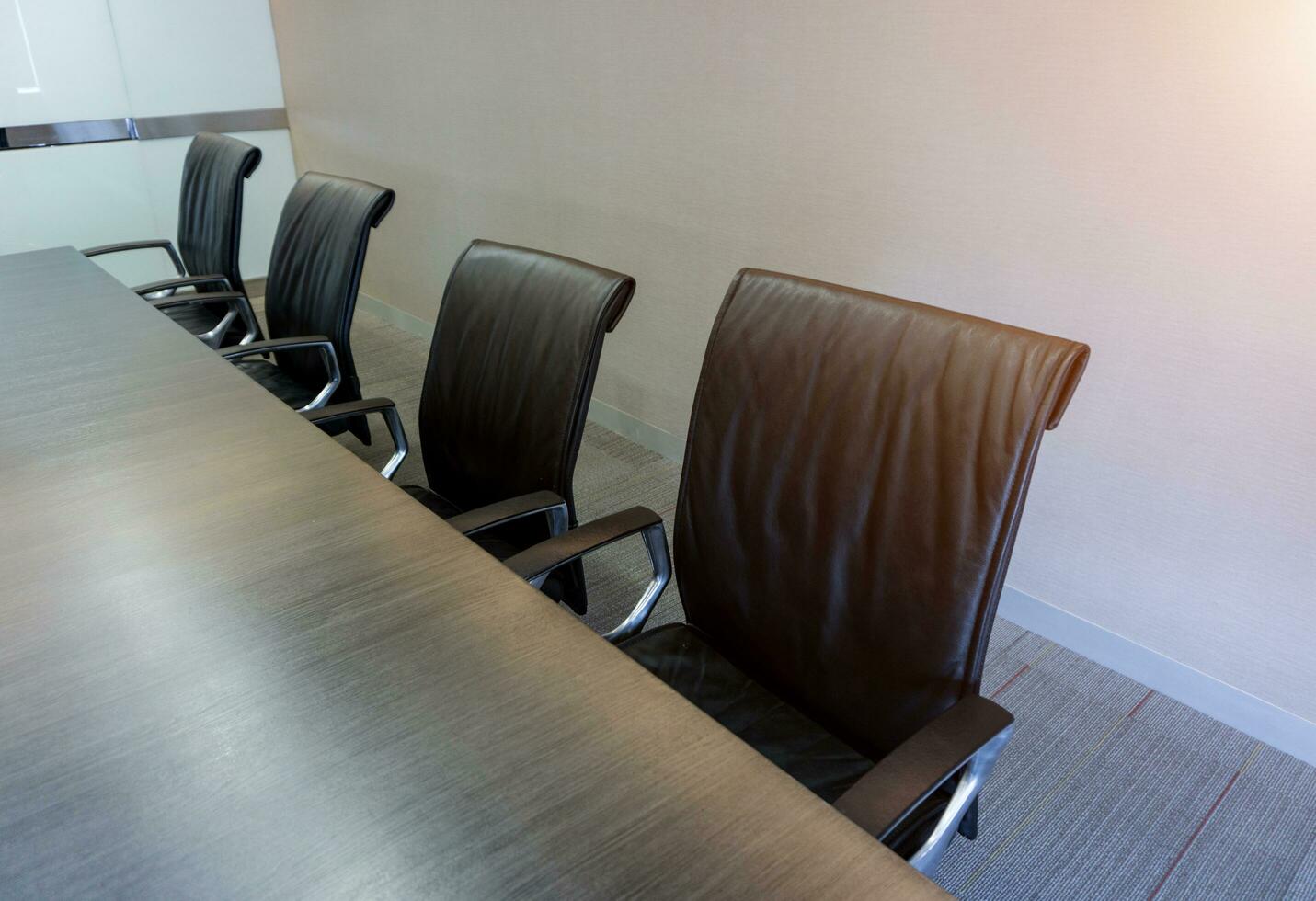 Empty corporate chair in conference room before business meeting. photo