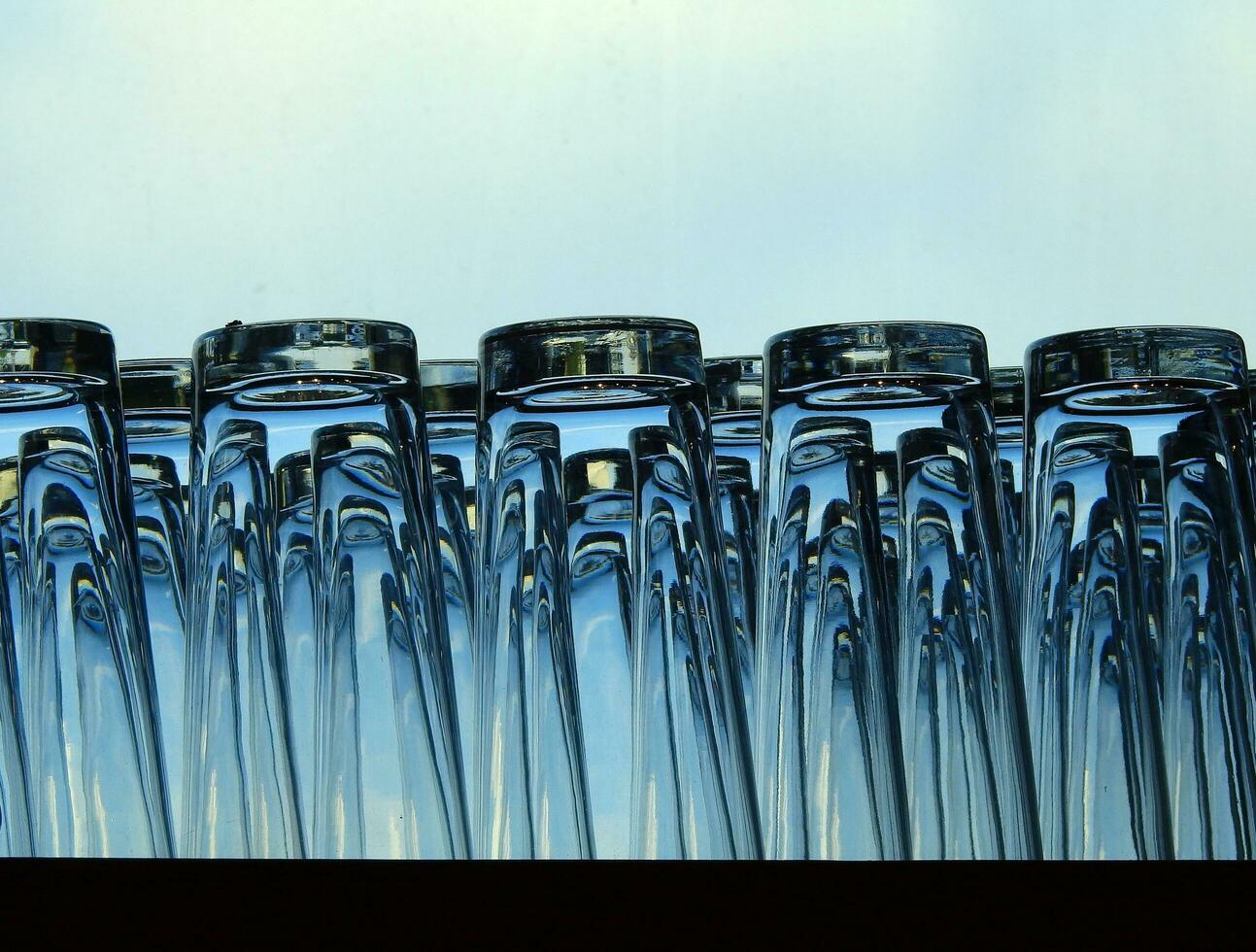 Crystal clear glass Placed on a blue background. photo