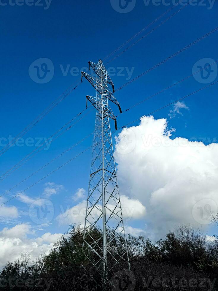 High voltage towers on skies background. Transmission line tower. photo