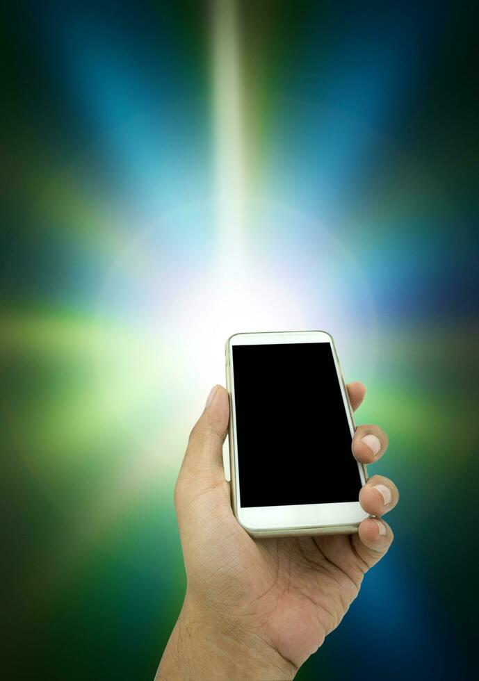 Man's hand shows white smartphone in vertical position photo