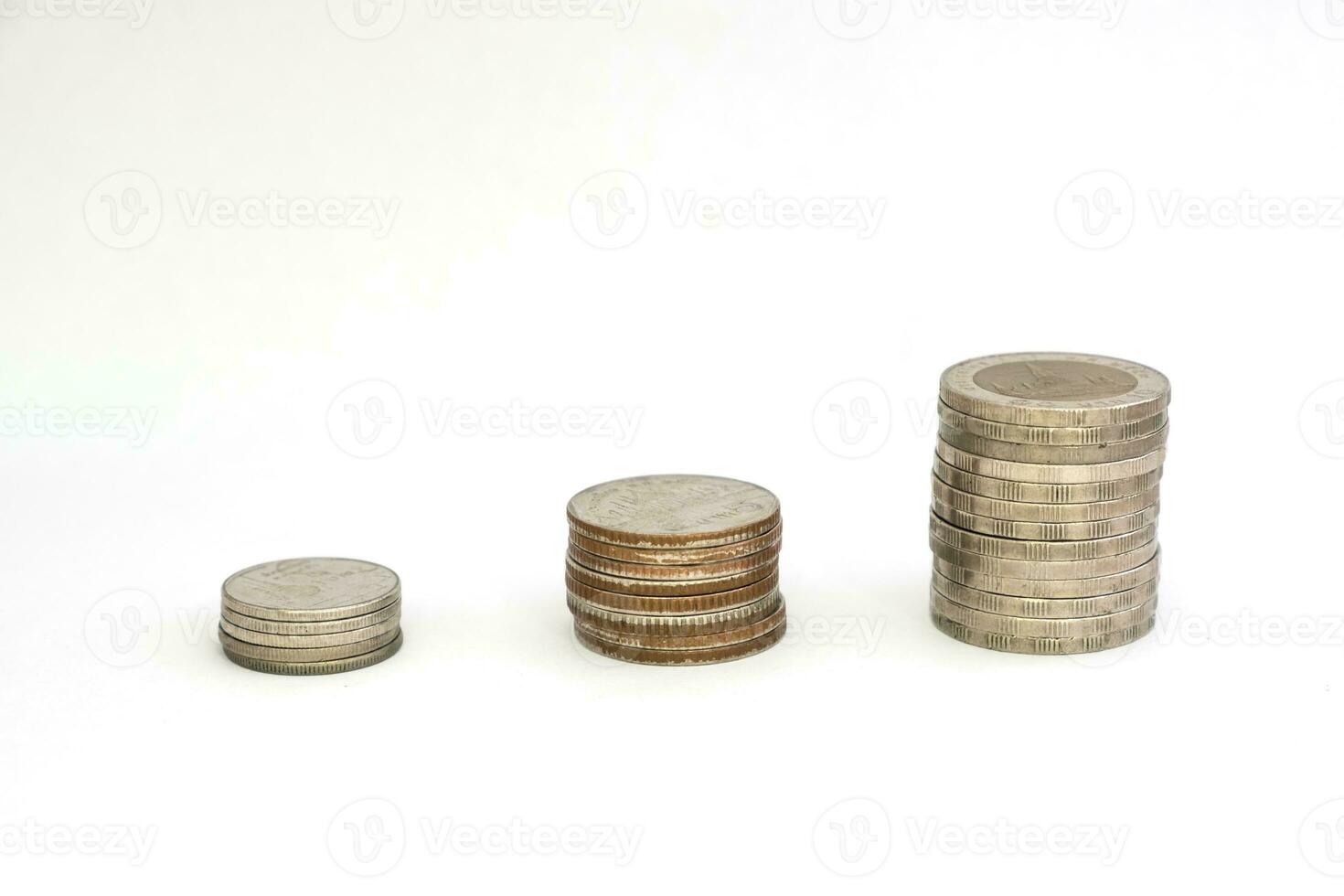 Stack coins growing or saving on white background photo