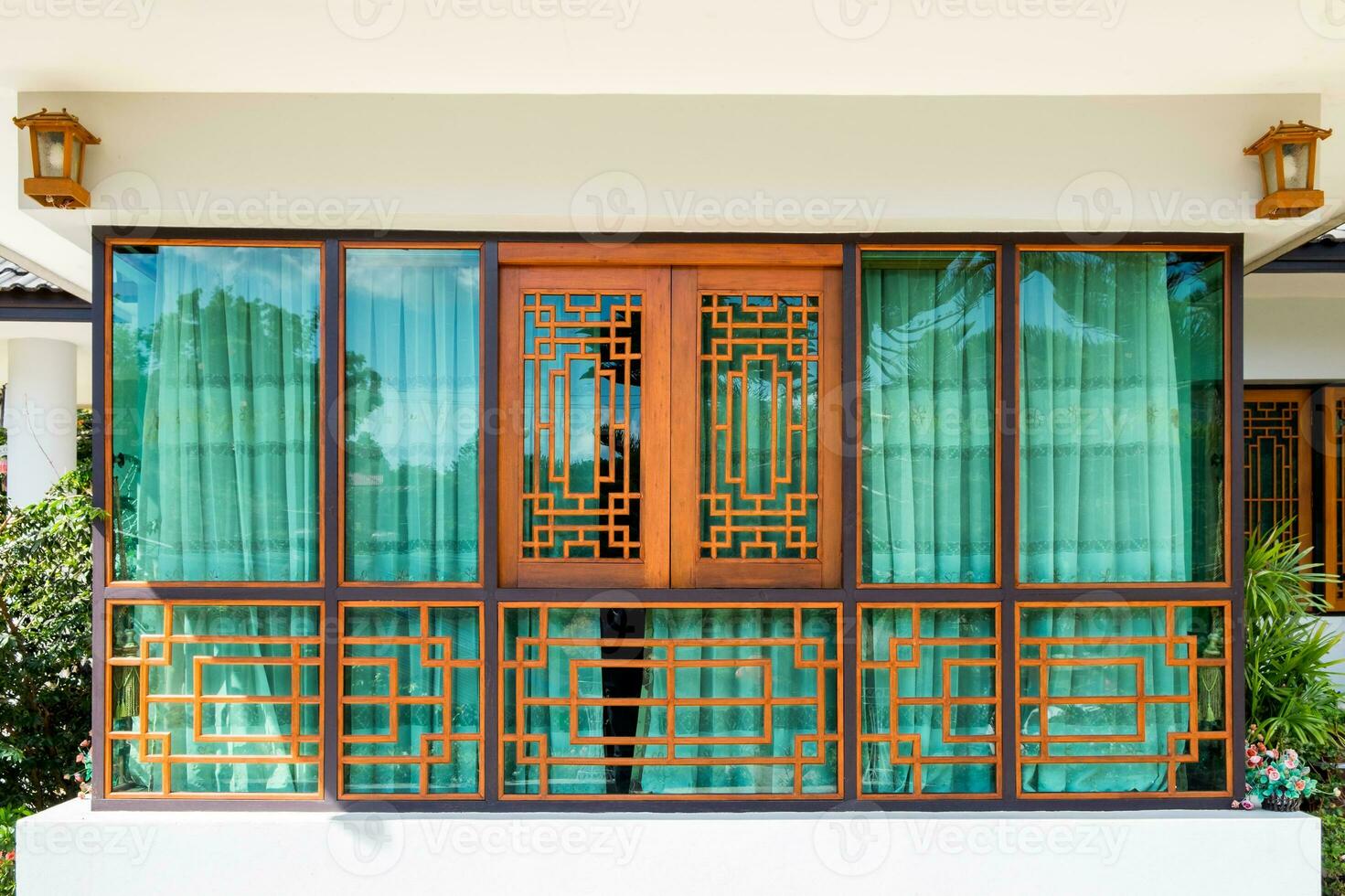 Wooden window and green curtain chinese tracery photo