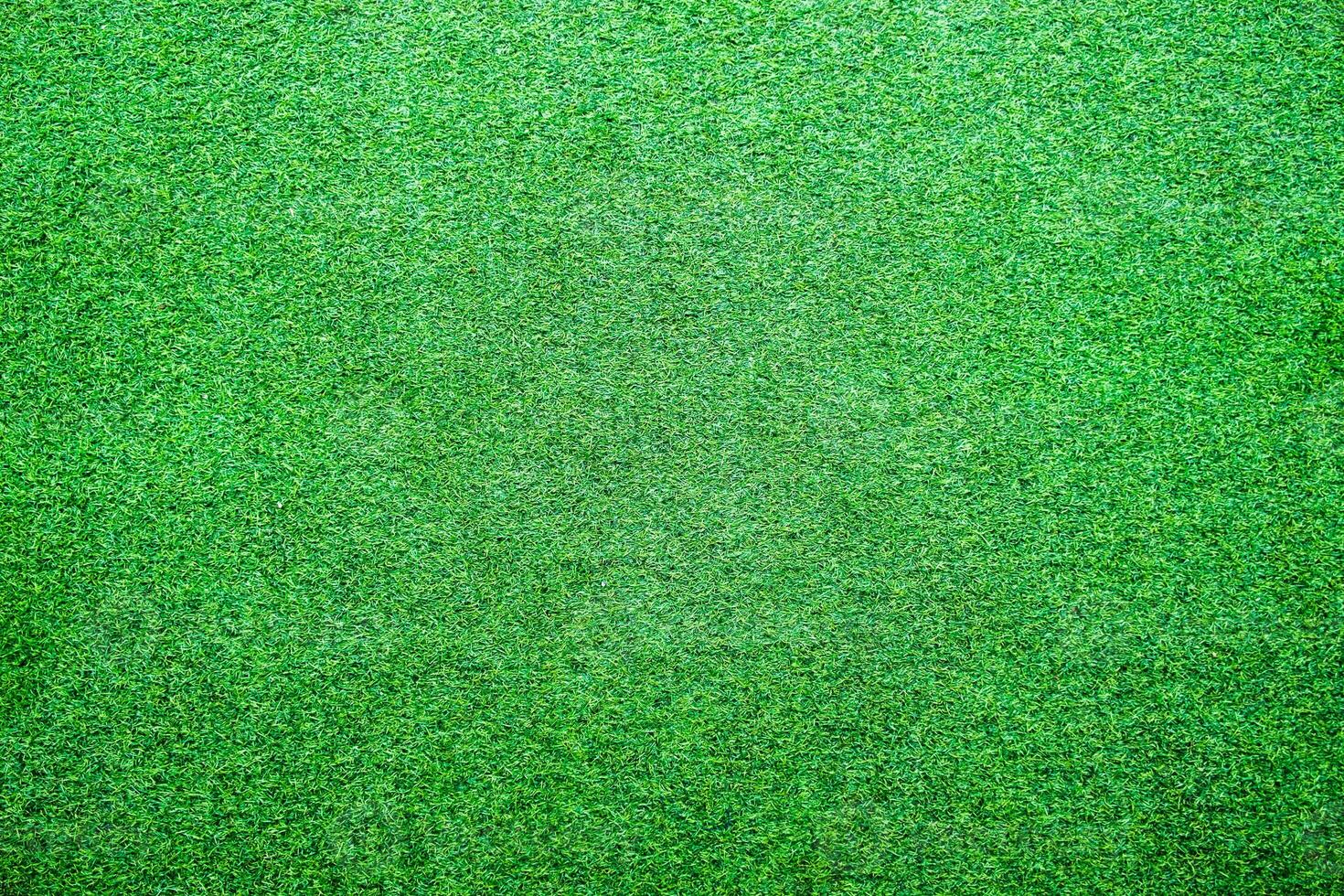 Artificial lawn grass green bright background photo