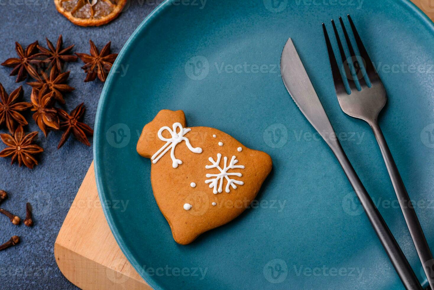 Beautiful festive Christmas composition of an empty plate, tangerine and gingerbreads photo