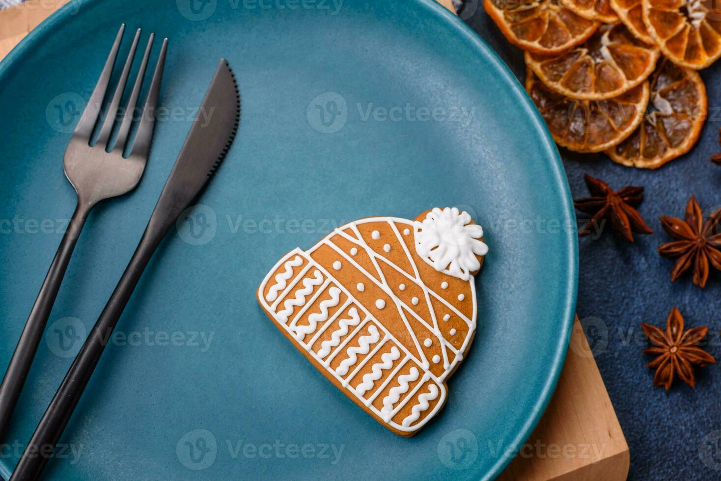 Beautiful festive Christmas composition of an empty plate, tangerine and gingerbreads photo