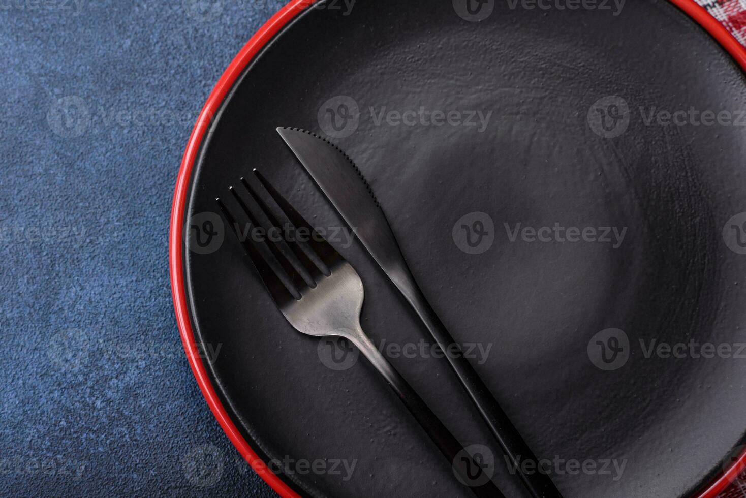 Round empty colored ceramic plate on concrete texture background photo
