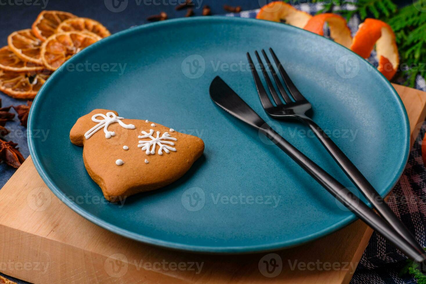 Beautiful festive Christmas composition of an empty plate, tangerine and gingerbreads photo