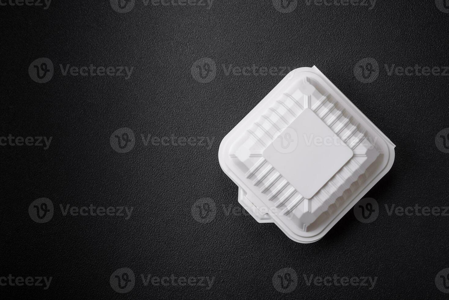 Square plastic or cardboard container of white color for food photo