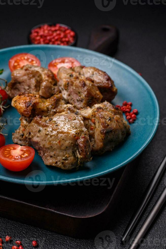 Delicious fried shish kebab of chicken or pork meat with salt, spices and herbs photo