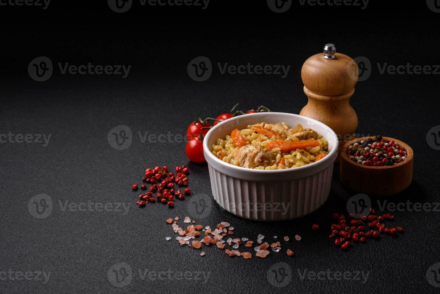Delicious Uzbek pilaf with chicken, carrots, barberry, spices and herbs photo