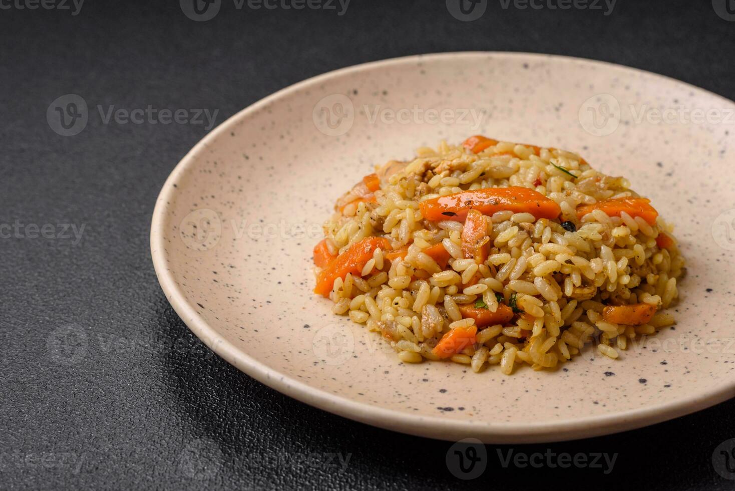 Delicious Uzbek pilaf with chicken, carrots, barberry, spices and herbs photo