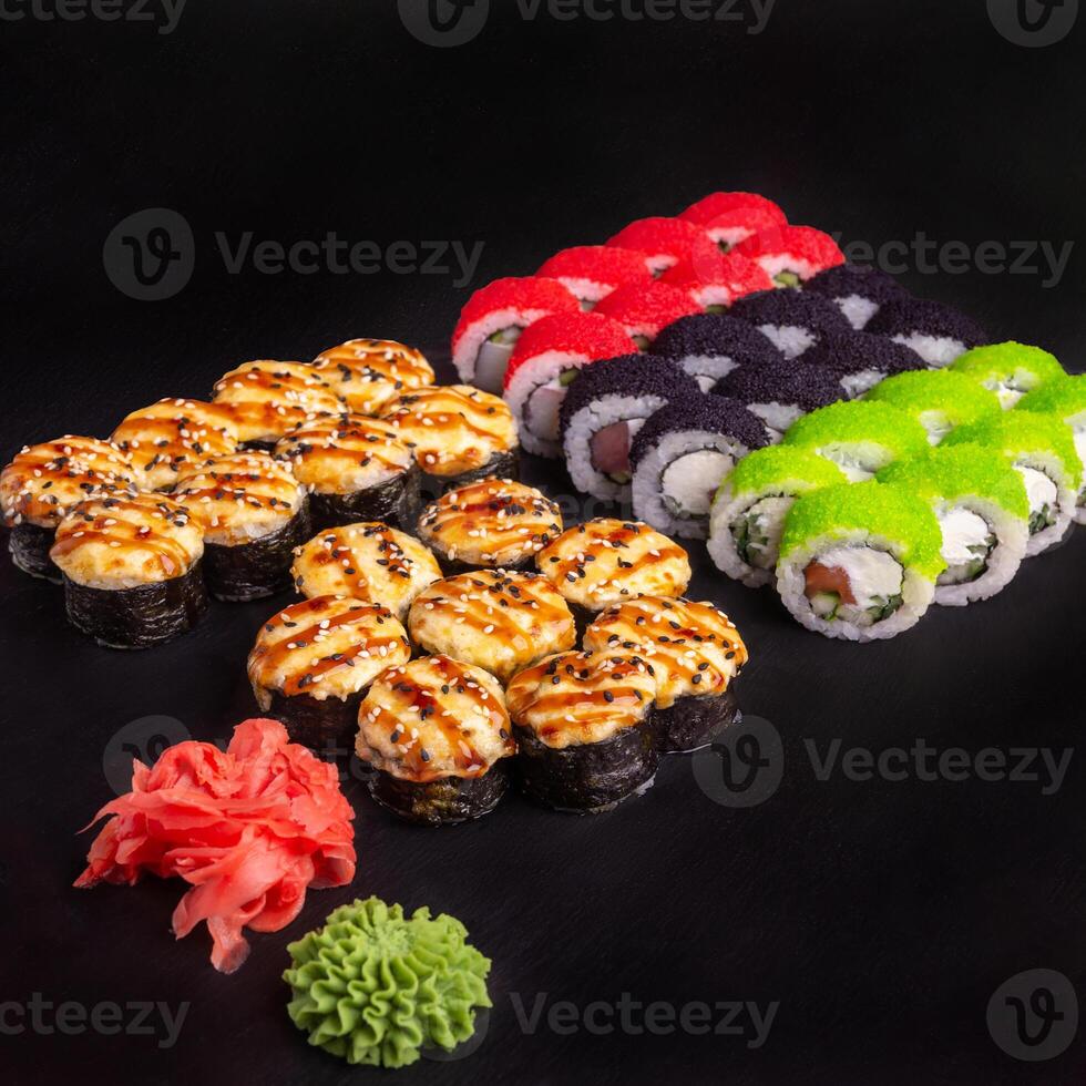 Sushi set with ginger and wasabi on a slate plate photo