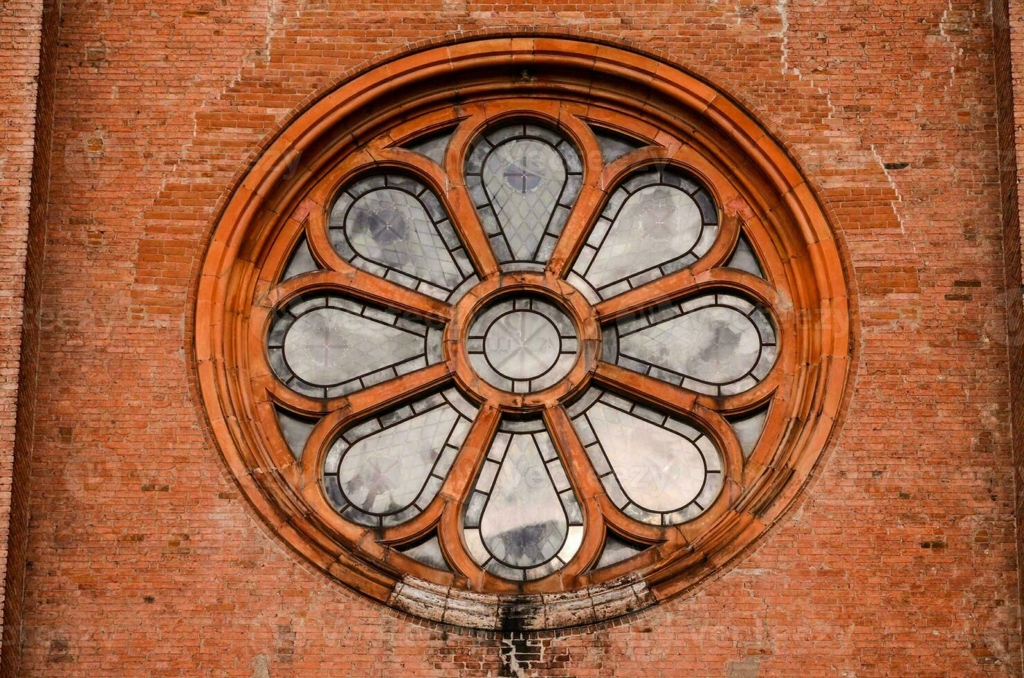 a round window with a flower design on it photo