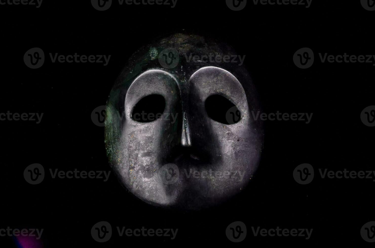 a mask with a black background photo