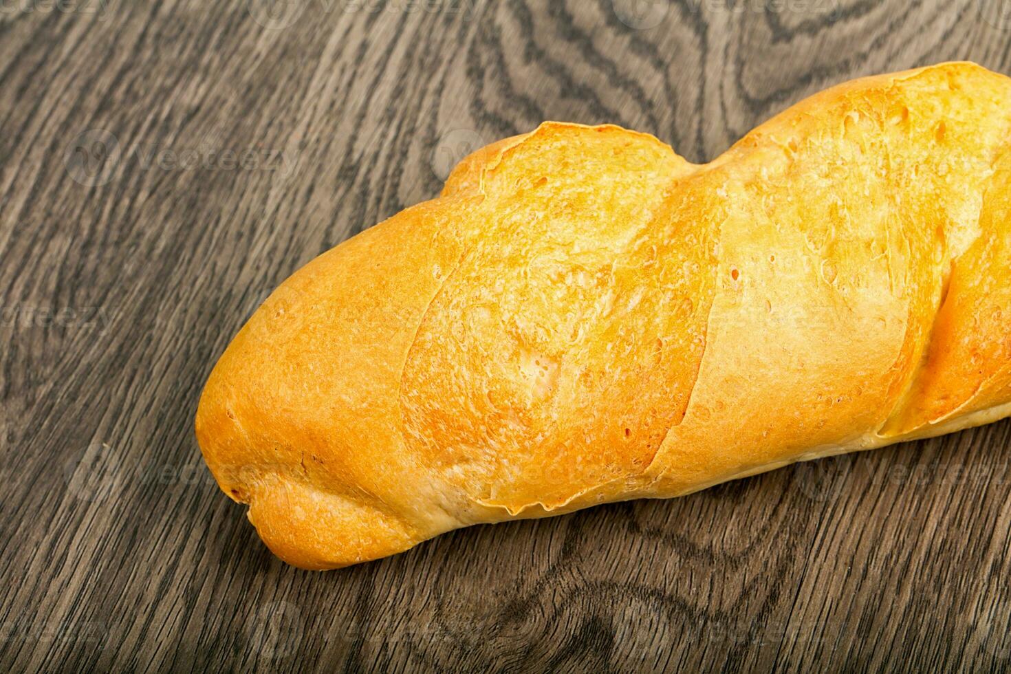 Baguette over wooden background photo