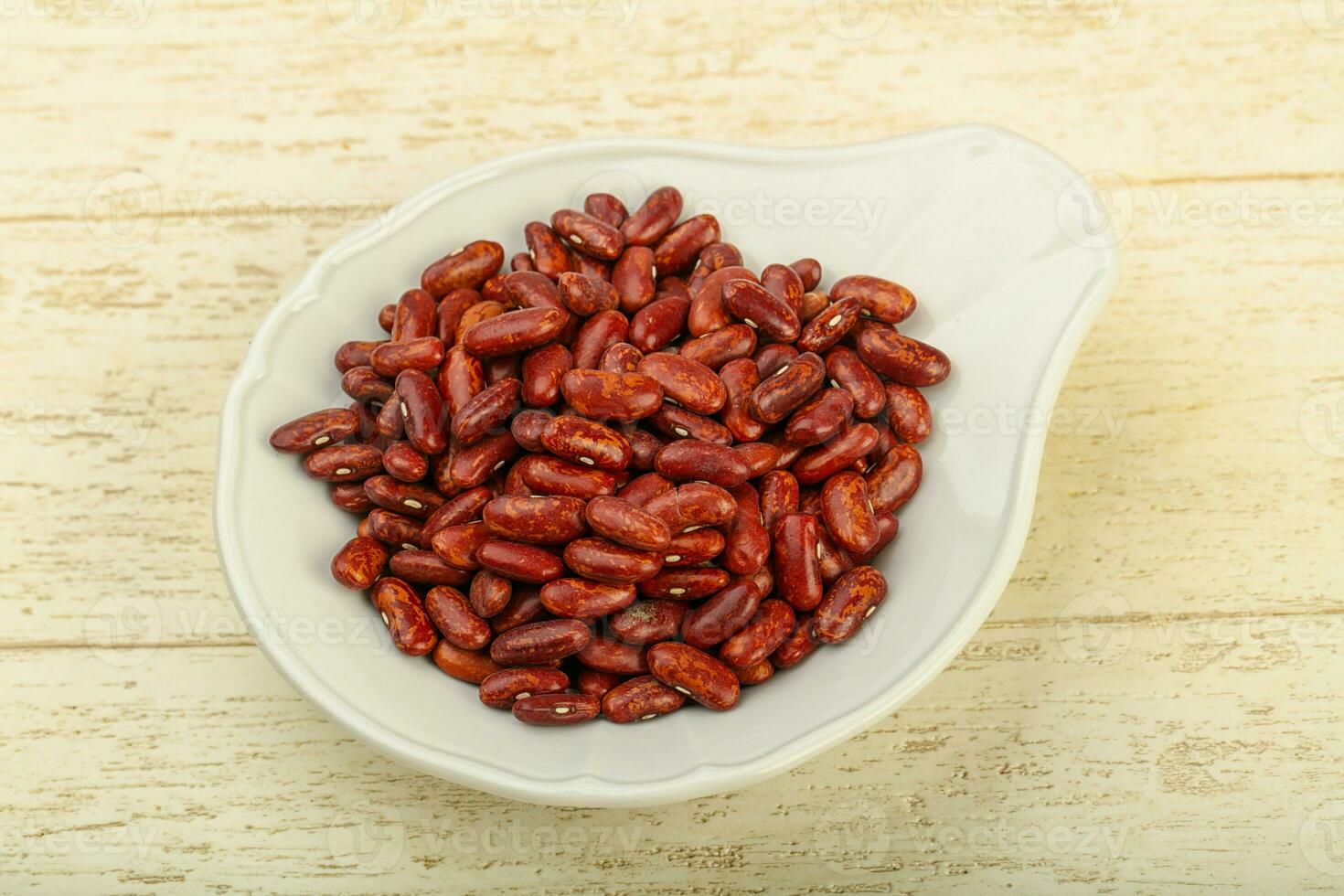 Dry beans over wooden background photo
