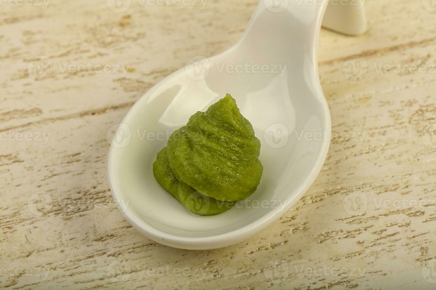 Wasabi over wooden background photo