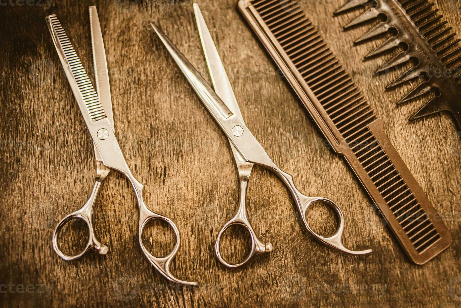 combs and scissors for haircuts lie on a shelf in the cabin photo