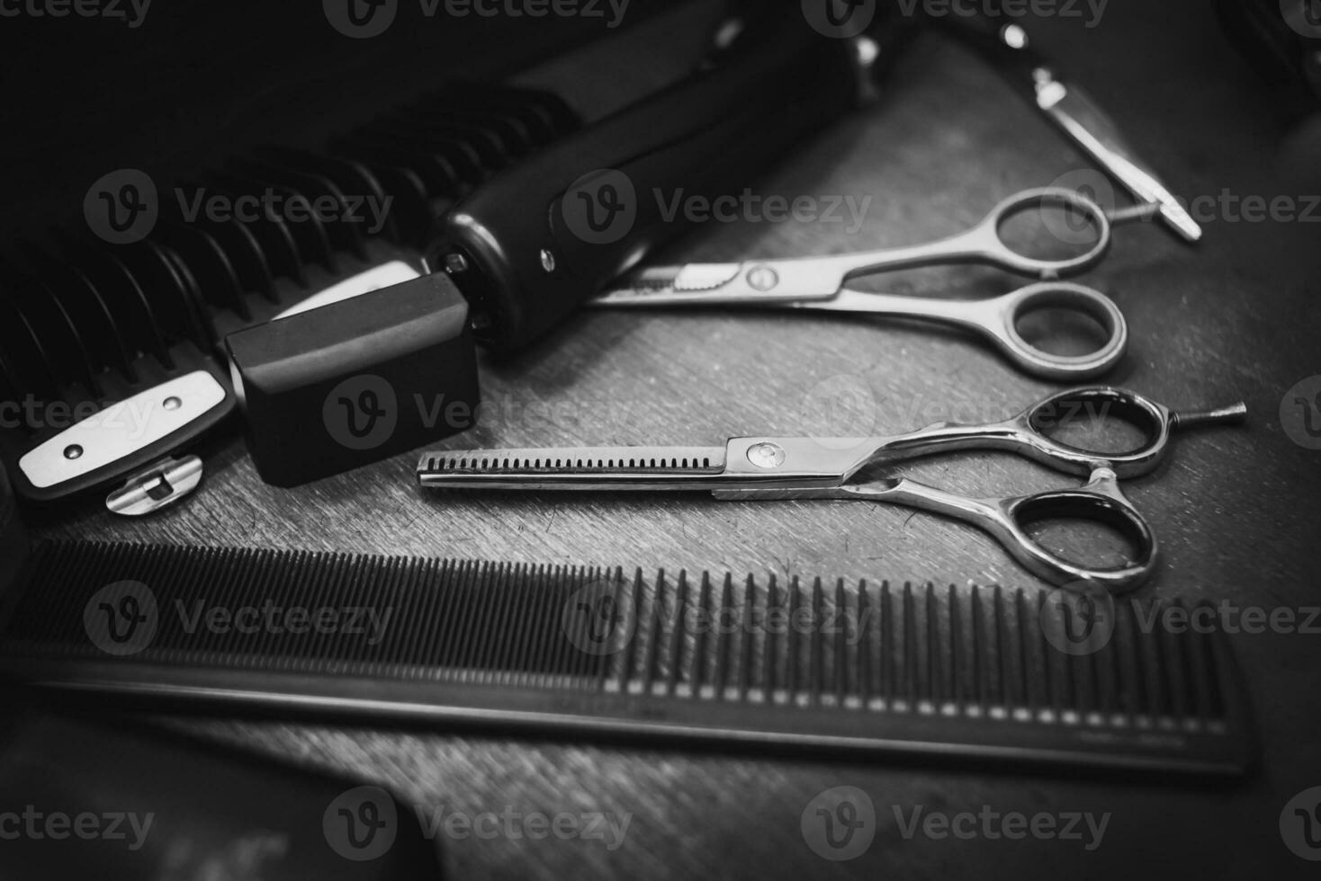 combs and scissors for haircuts lie on a shelf in the cabin photo