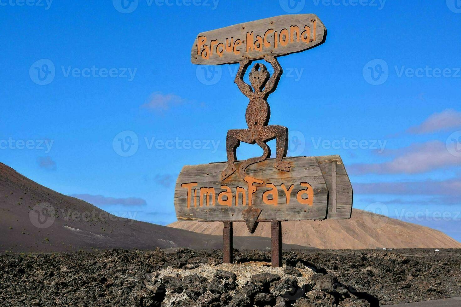 a wooden sign of a man that says timanfaya photo