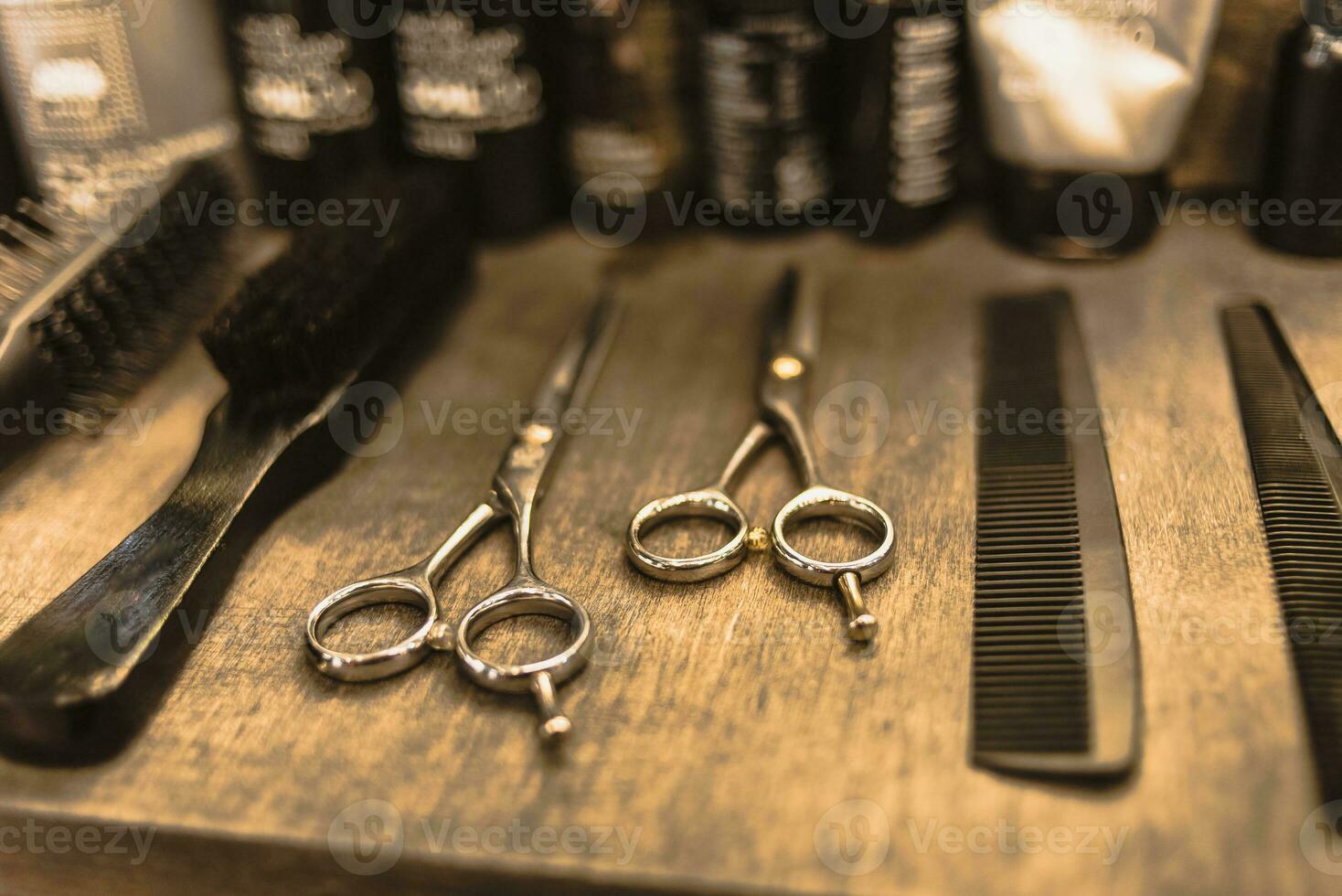 professional scissors and combs lie on a shelf in a hairdresser photo