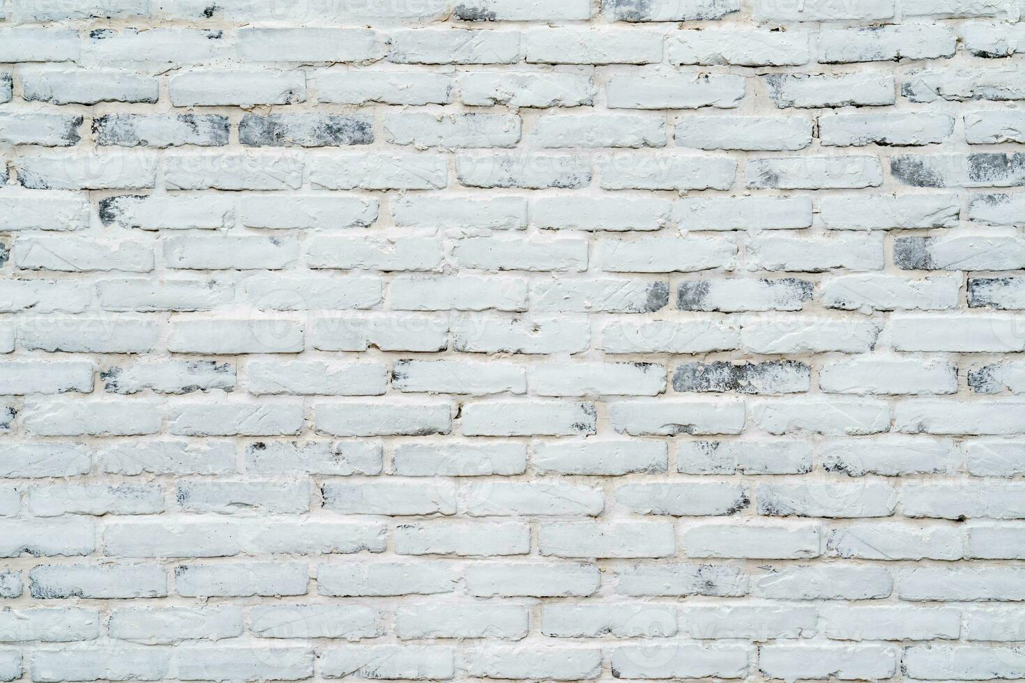 Brick wall wallpaper texture clinker and concrete pattern in old vintage white colour theme under the constuction area photo