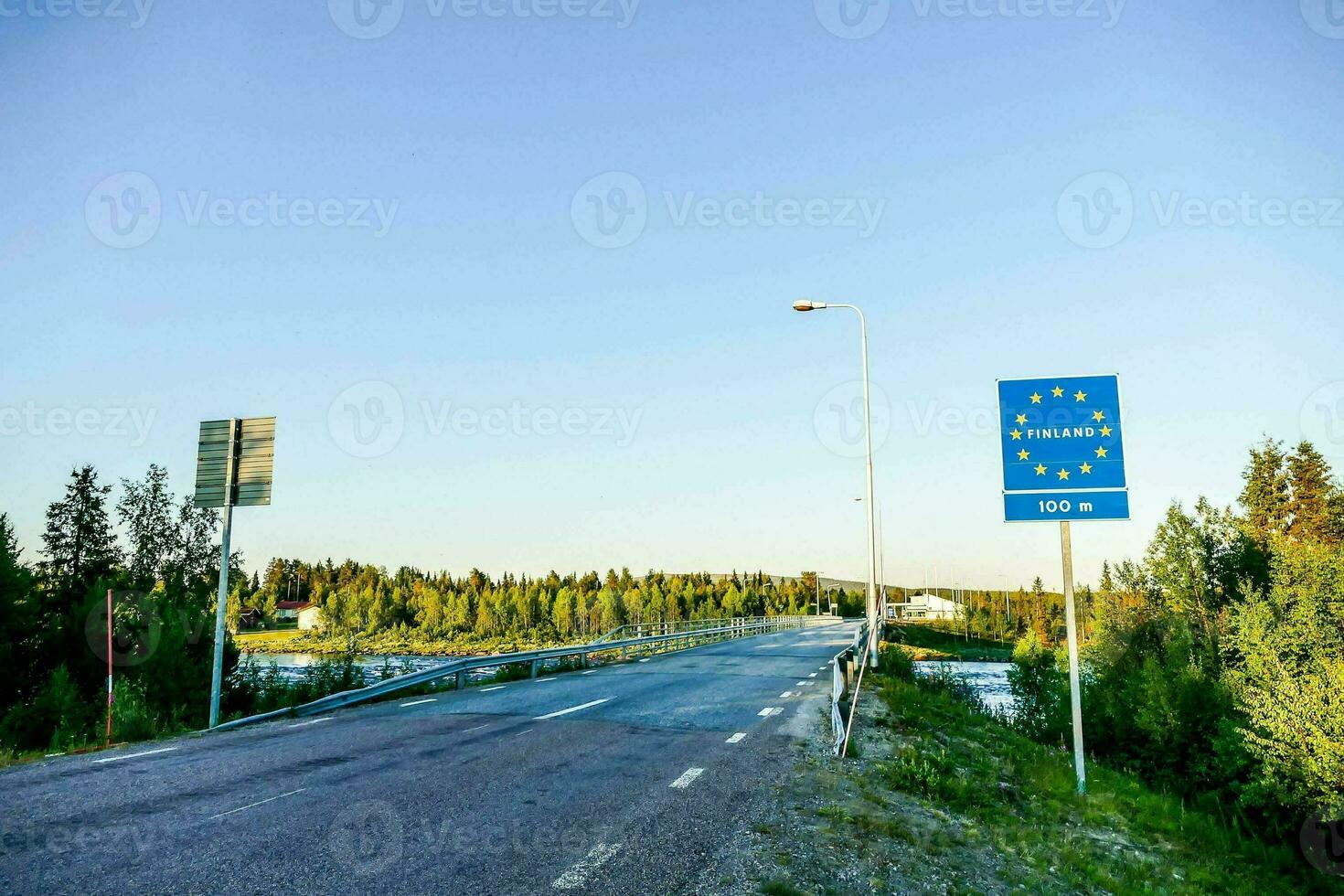 a road with a sign that says finland photo