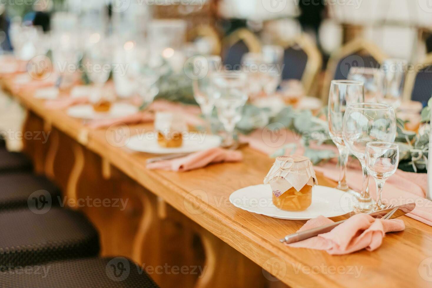 Beautiful wedding table setting decorated with flowers and candles photo