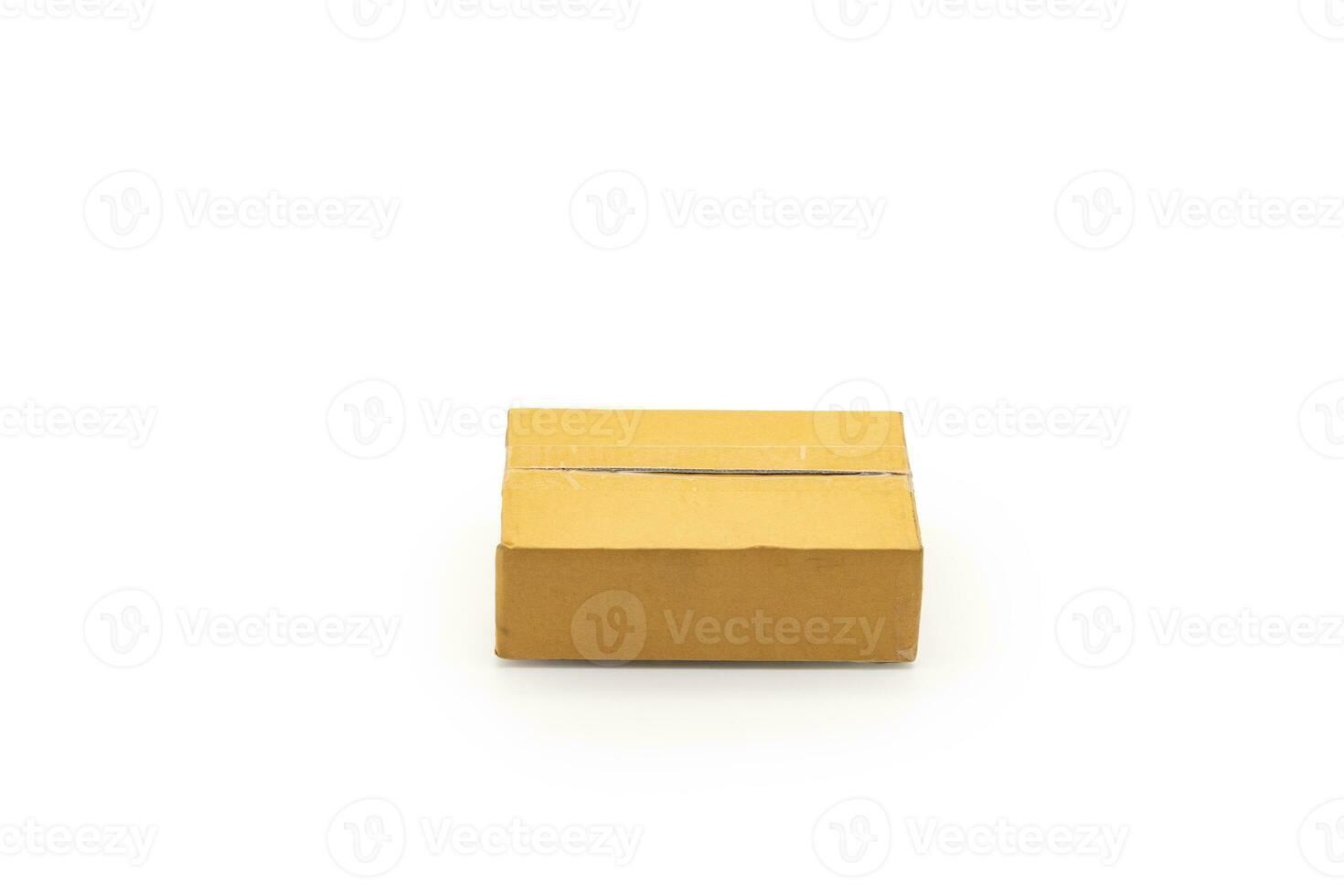 Isolated one brown paper box Postal Package from shopping online, is delivered to the buyer. It's shot in the studio light in front of white background. Clipping Paths. photo