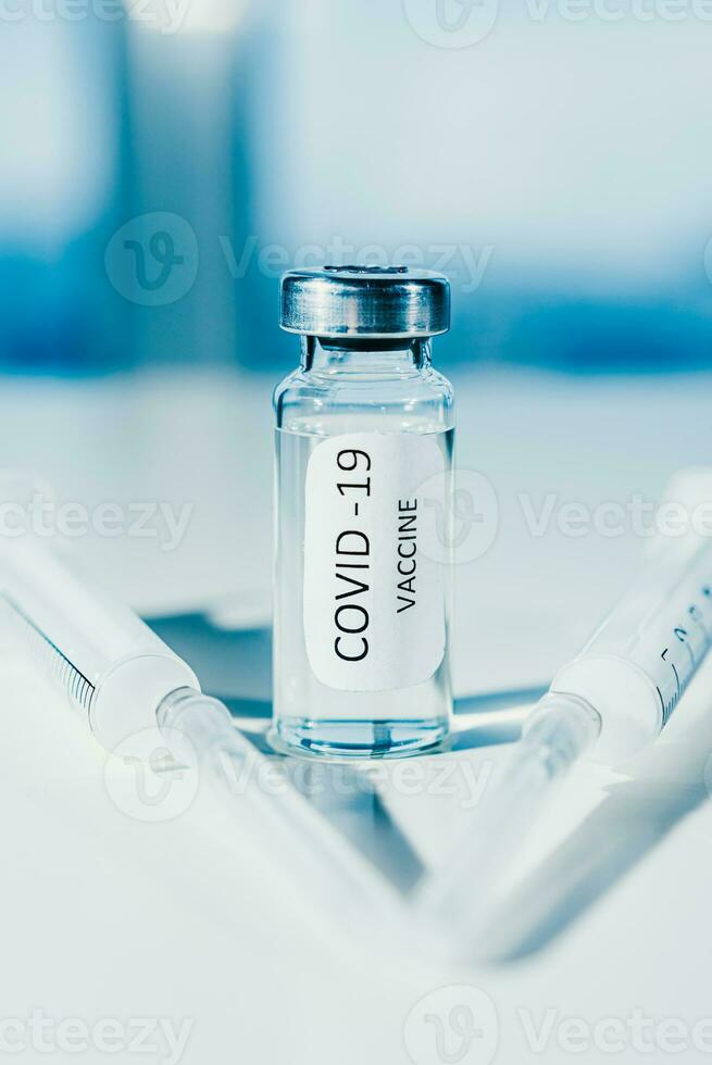 COVID-19 coronavirus vaccine. Ampoule and syringe close-up. Concept photo