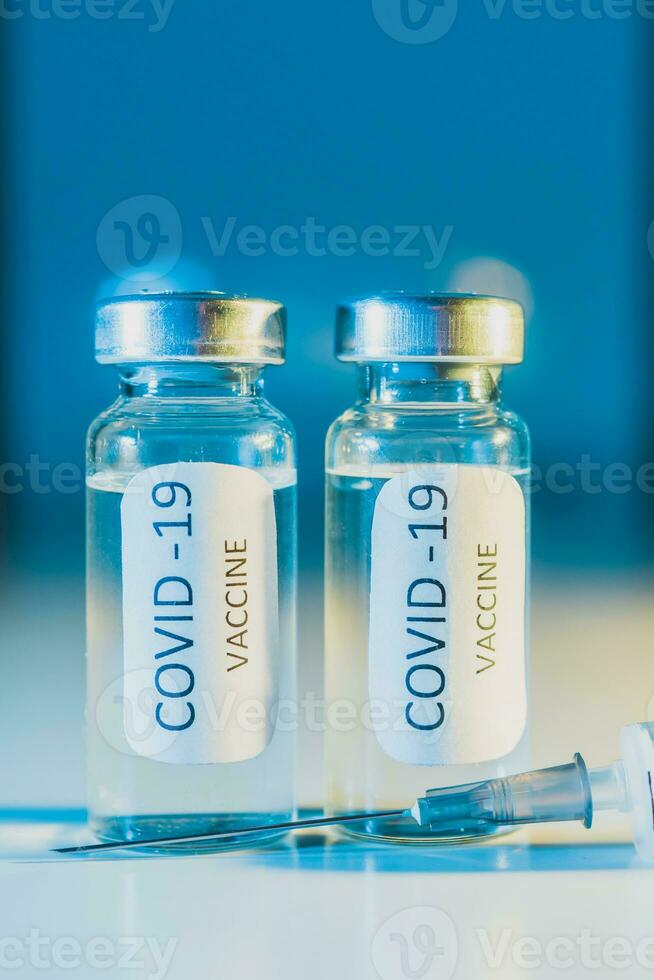 COVID-19 coronavirus vaccine. Ampoule and syringe close-up. Concept photo