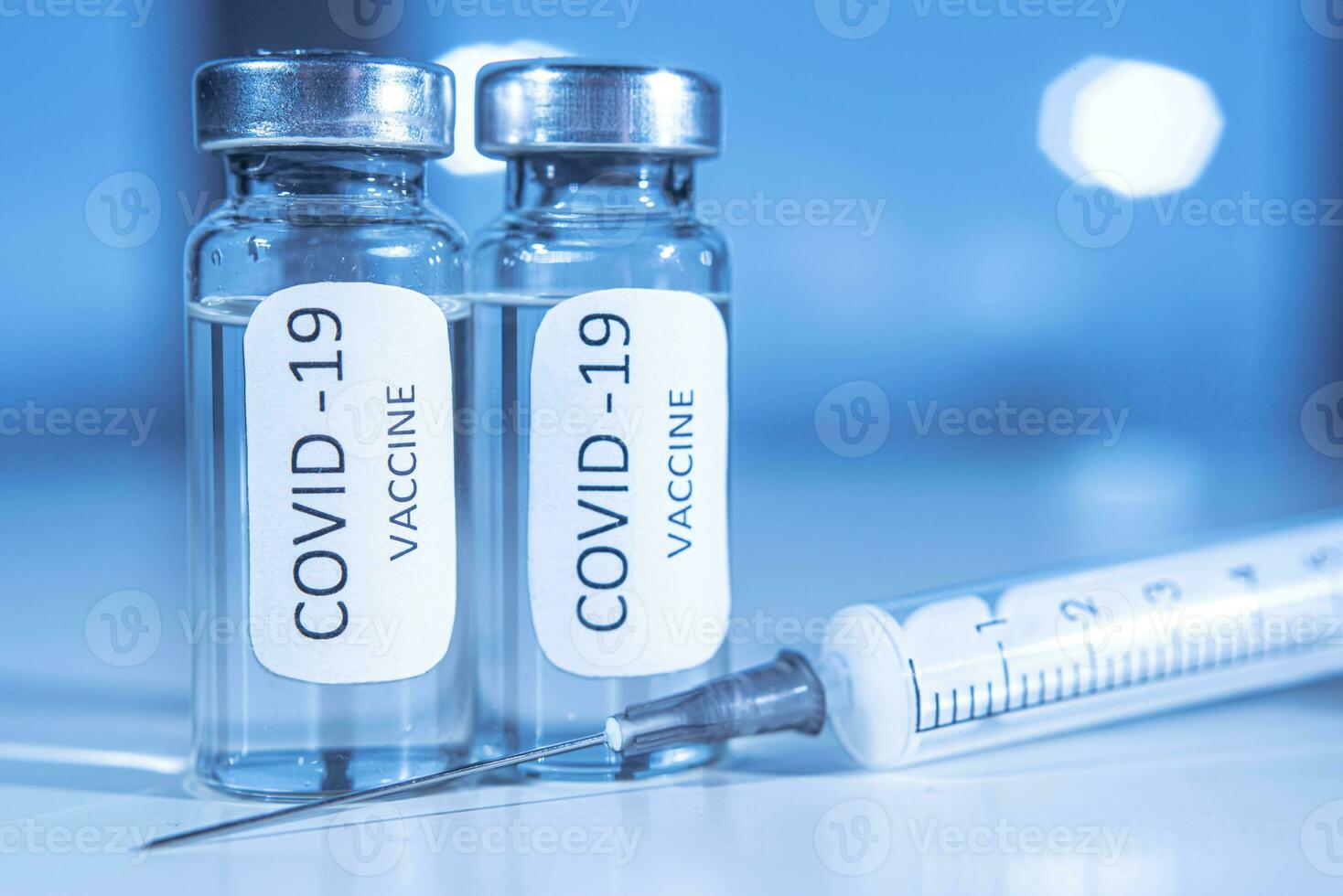 Vaccination against coronavirus COVID-19. Ampoule and syringe close-up. Concept photo