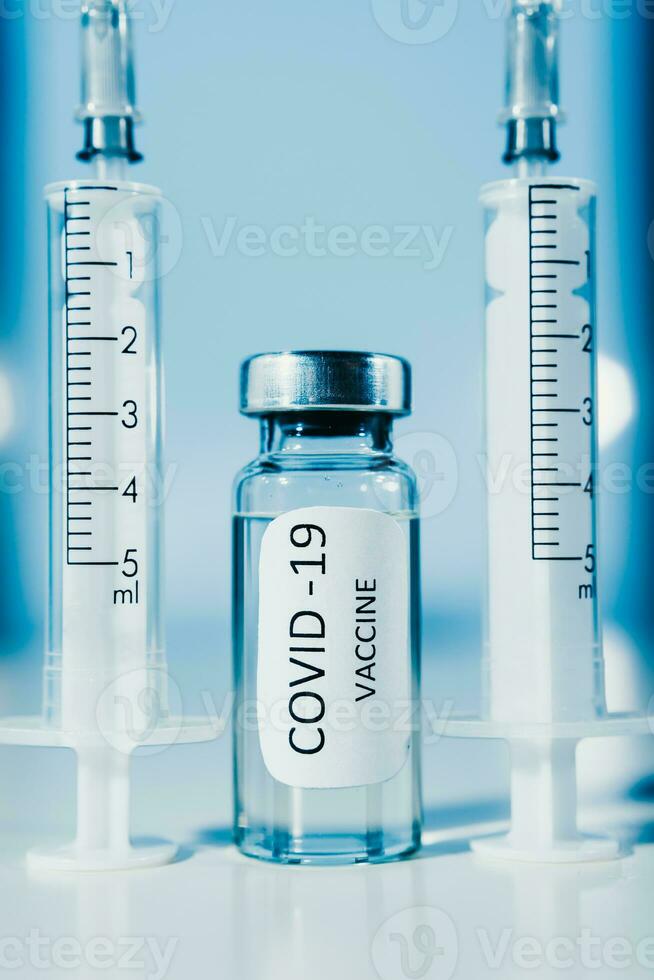 COVID-19 coronavirus vaccine. Ampoule and syringe close-up. Concept photo