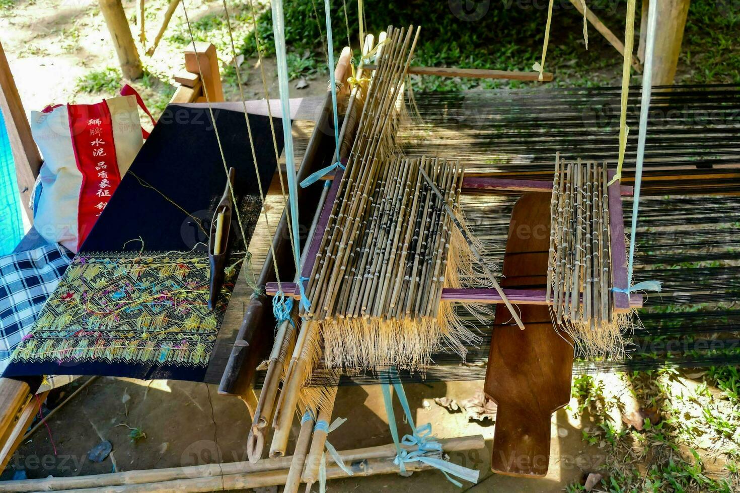 a weaving machine with a loom and some other items photo