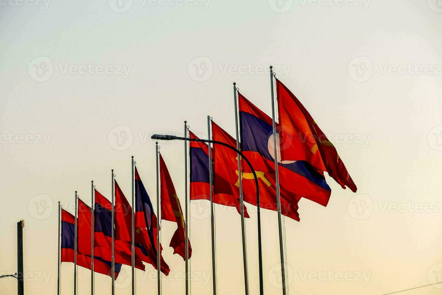 the flags of cambodia are flying in the wind photo