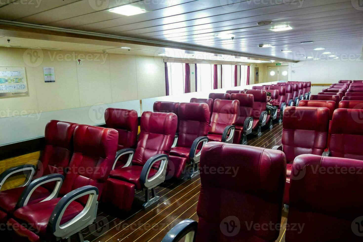 the interior of a boat with red leather seats photo