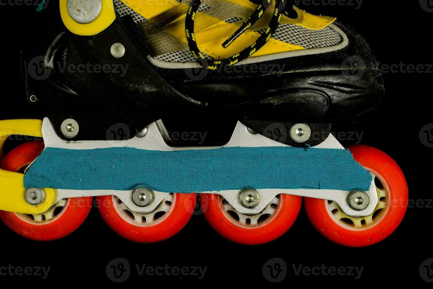 a roller skate on black background photo